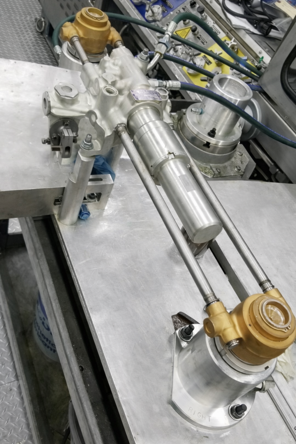 Close-up of aircraft hydraulic or mechanical components during inspection